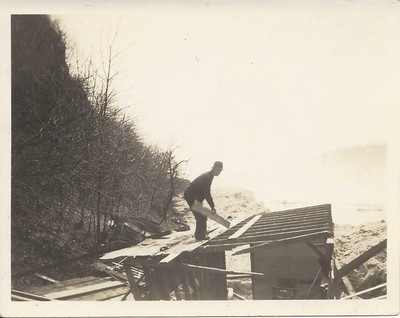 Bu, William Henry Burgess tearing down the Cavanaugh Souvenir Stand below the Falls after the Honeymoon Bridge fell 27 Jan 1938 4.jpg